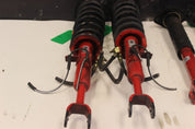 Infiniti G35 Stock OEM Shocks and Struts Tokico Red Color